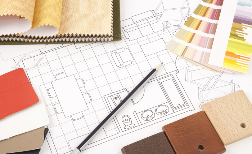 Design studio moodboard with fabric swatches and floor plans